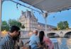 A group of tourists on a Seine River Cruise in Paris.