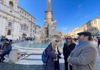 A group of tourists at Piazza Navona in Rome.