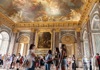 A tour group inside the King's State Room looking at the artwork on the celling and wall.