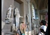 A group of tourists inside the Vatican Museums.