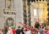 A group of tourists inside St. Peter's Basilica.