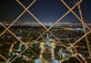 The view from the Eiffel Tower at night while standing on the summit.