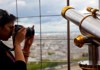 lady taking picture eiffel