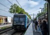 A picture of a metro train pulling into the station in Paris.