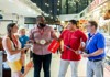 A group of tourists visiting the Versailles outdoor market with their guide from The Tour Guy.