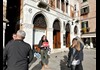 A group of tourists in front of Despar Teatro Italia with a guide from The Tour Guy.