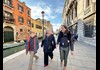 A mother and son walking in Venice with a guide from The Tour Guy.