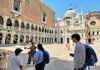 people taking photos in courtyard