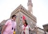 A man in front of Palazzo Vecchio listening to a guide from The Tour Guy.