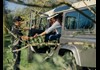 Woman getting out of jeep with aid of driver