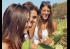 people smiling in vineyard