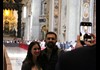 A couple having their picture taken inside St. Peter's Basilica.