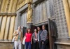 A tour group entering Westminster Abbey with their guide from The Tour Guy.