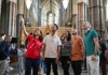 A group of tourists inside Westminster Abbey with a guide from The Tour Guy.