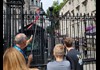 A group of tourists looking at 10 Downing Street while on tour with The Tour Guy.