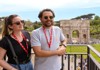 A pair of tourists standing in front of the Arch of Constantine while on tour with The Tour Guy.