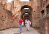 A tourist walking through the Palatine HIll with her guide from The Tour Guy.