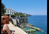 An image of a woman looking out over Sorrento.