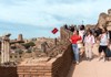 A group of tourists walking down the Palatine Hill with their guide from The Tour Guy.