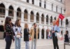A group of tourists in front of Doge's Palace with a guide from The Tour Guy.