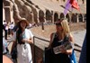 A tourist walking through the Colosseum along with a guide from The Tour Guy.