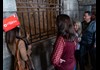 A group of tourists in the Doge's Palace dungeon listening to their guide from The Tour Guy.