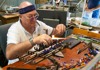 A man doing a glass blowing demonstration.