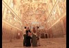 A family inside of the Sistine Chapel.