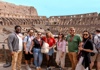 A group of tourists standing on the 2nd level of the Colosseum with their guide from The Tour Guy.