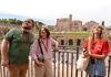 A pair of tourists looking at the Temple of Venus and Rome with their guide from The Tour Guy.