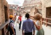 A group of tourists entering the Colosseum Arena Floor with their guide from The Tour Guy.