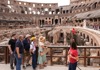 A group of tourists on the 1st level of the Colosseum with their guide from The Tour Guy.