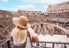 A woman looking over the Arena Floor at the Colosseum.