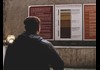 man looking at sign
