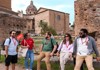 A group of tourists infront of the Senate House in the Roman Forum with their guide from The Tour Guy.
