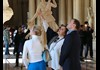 A group of tourists in the Louvre Museum.