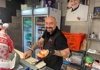 Man preparing a tradition sandwich in Testaccio Market
