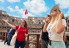 A group of tourists at the Colosseum with their guide from The Tour Guy.