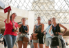 A group inside the Louvre Museum listening to their guide from The Tour Guy.