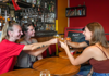 A group of tourists enjoying wine with their guide from The Tour Guy.